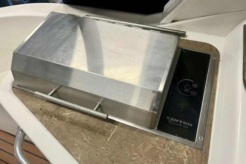  Yacht Photos Pics Built-in Kenyon grill on 2011 Cruisers Yachts 330 Express boat.