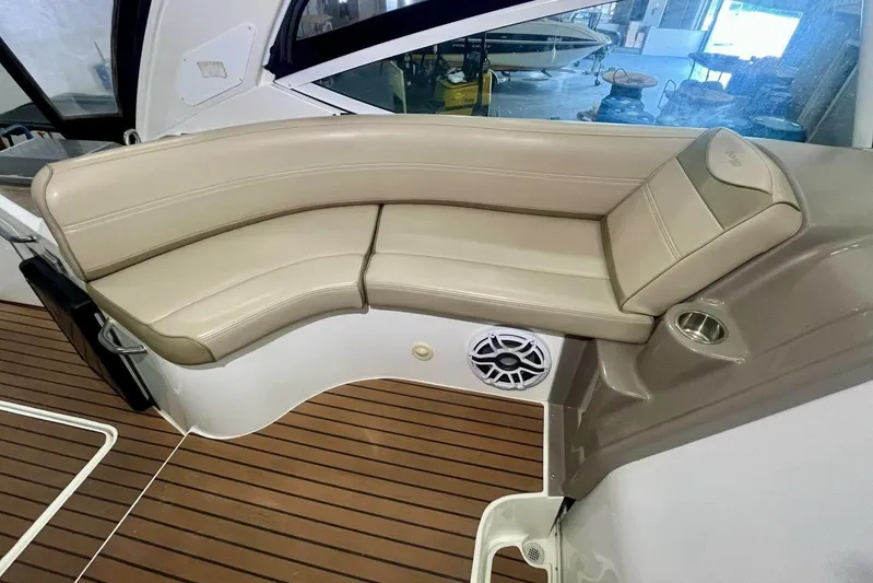  Yacht Photos Pics 2011 Cruisers Yachts 330 Express interior with beige seating and wood flooring.