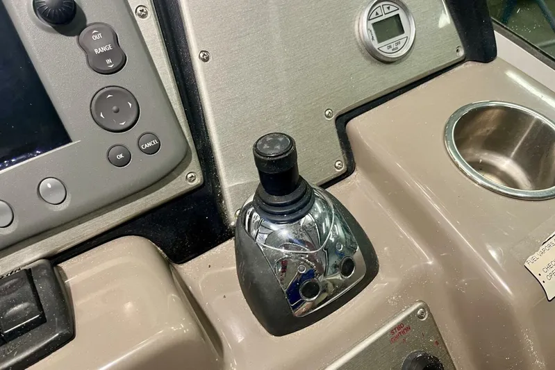  Yacht Photos Pics Control panel of 2011 Cruisers Yachts 330 Express with joystick and buttons.