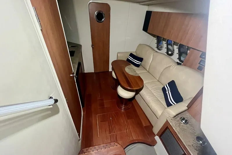  Yacht Photos Pics Interior of 2011 Cruisers Yachts 330 Express with leather seating and wooden accents.