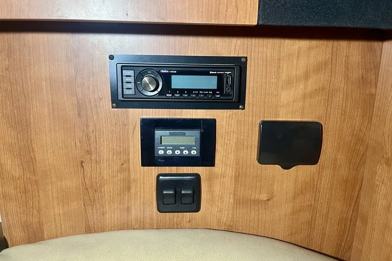  Yacht Photos Pics Control panel of 2011 Cruisers Yachts 330 Express with audio and system controls.