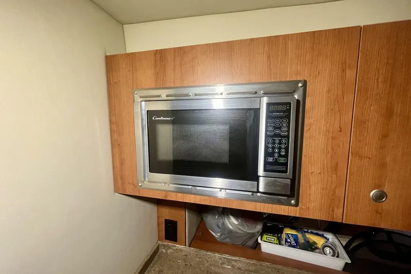  Yacht Photos Pics Built-in microwave in 2011 Cruisers Yachts 330 Express galley kitchen.
