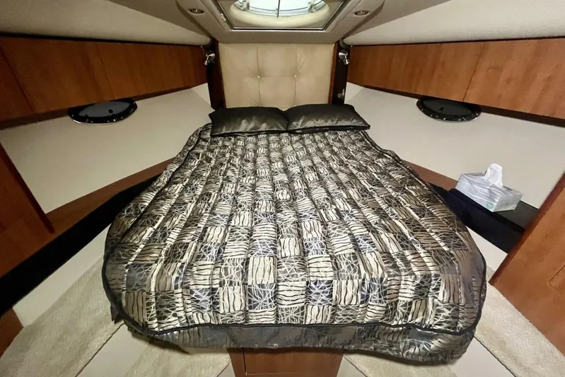  Yacht Photos Pics Luxurious cabin interior of 2011 Cruisers Yachts 330 Express with elegant bedding.