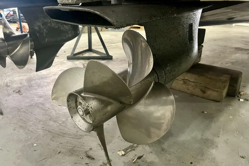  Yacht Photos Pics 2011 Cruisers Yachts 330 Express propeller in a workshop setting.