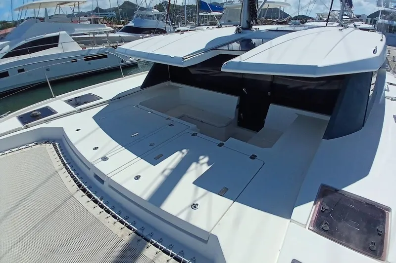 Mere Cat Yacht Photos Pics 2018 Leopard 45 catamaran deck view with open hatches in marina setting.