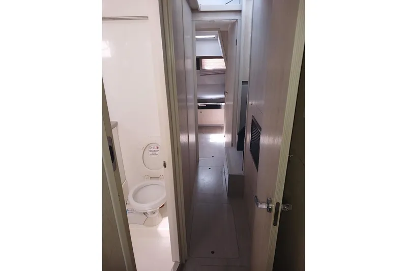 Mere Cat Yacht Photos Pics Interior of 2018 Leopard 45 yacht showing hallway and bathroom.