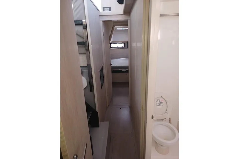 Mere Cat Yacht Photos Pics Interior of 2018 Leopard 45 yacht showing hallway and bathroom.