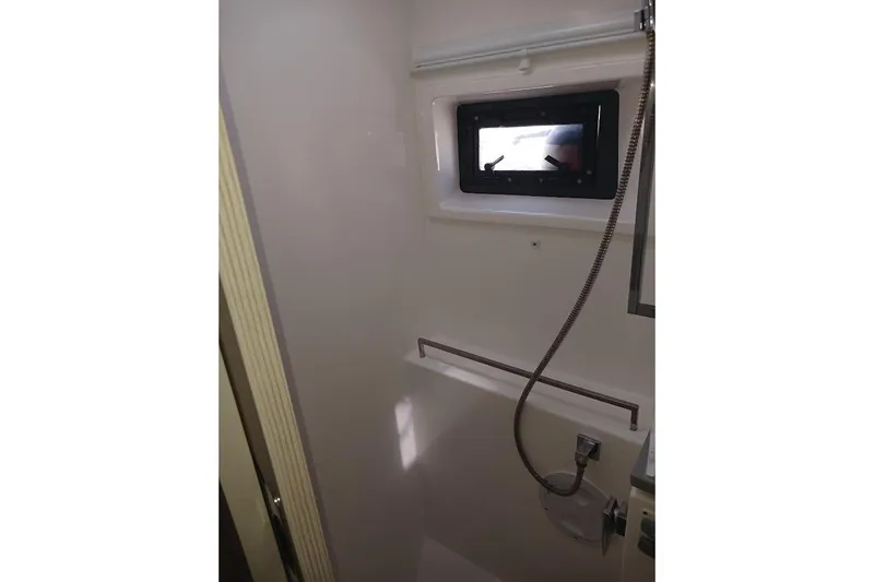 Mere Cat Yacht Photos Pics Bathroom interior of 2018 Leopard 45 yacht with window and showerhead.