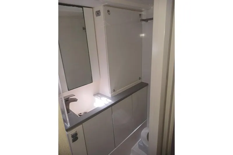 Mere Cat Yacht Photos Pics Compact bathroom in a 2018 Leopard 45 yacht, featuring modern fixtures and storage.
