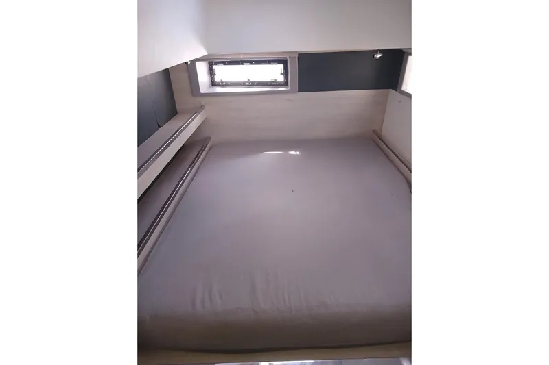 Mere Cat Yacht Photos Pics Interior cabin of 2018 Leopard 45 yacht with bed and window.