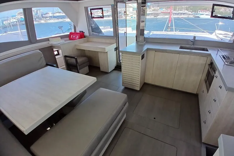 Mere Cat Yacht Photos Pics Modern interior of 2018 Leopard 45 catamaran with spacious kitchen and dining area.