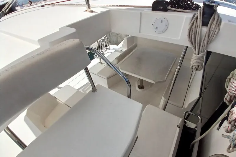 Mere Cat Yacht Photos Pics Interior view of 2018 Leopard 45 catamaran cockpit with seating and table.
