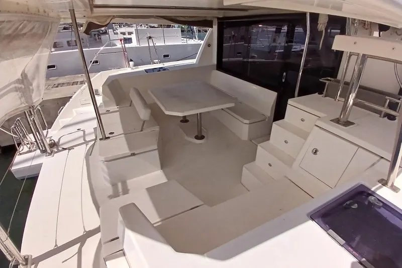 Mere Cat Yacht Photos Pics Spacious deck of 2018 Leopard 45 catamaran with seating and table.