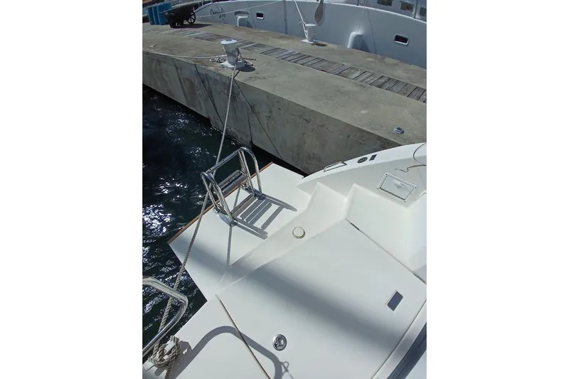 Mere Cat Yacht Photos Pics Leopard 45 catamaran docked, showing deck and ladder, 2018 model.