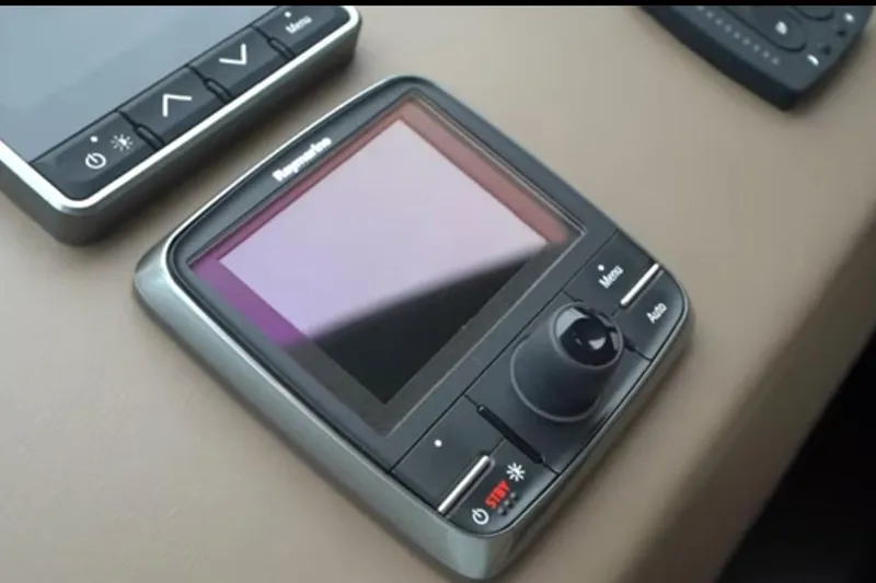 No Name Yacht Photos Pics Control panel on 2017 Azimut 66 yacht dashboard, featuring navigation and adjustment buttons.