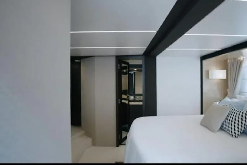 No Name Yacht Photos Pics Luxurious interior of 2017 Azimut 66 yacht, featuring modern bedroom design and elegant decor.
