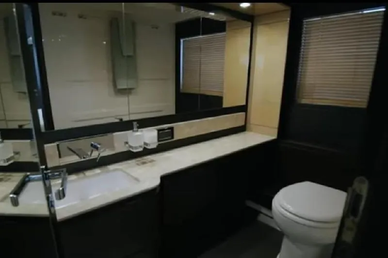 No Name Yacht Photos Pics Luxurious bathroom in 2017 Azimut 66 yacht with modern fixtures and elegant design.