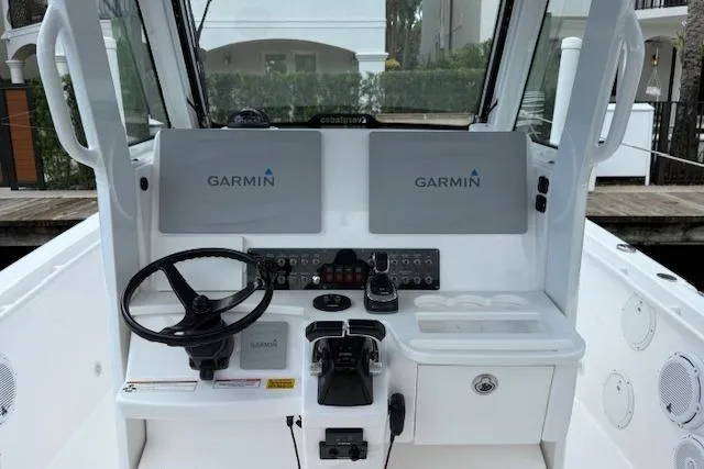 Plan Sea Yacht Photos Pics 2019 Everglades 295 Center Console boat dashboard with Garmin navigation displays.