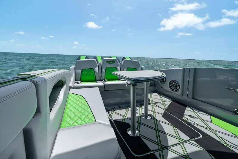  Yacht Photos Pics Luxury interior of 2026 Deep Impact 399 Sport boat with green accents and ocean view.