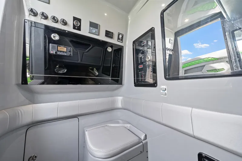  Yacht Photos Pics Interior of 2026 Deep Impact 399 Sport boat, featuring control panel and seating.