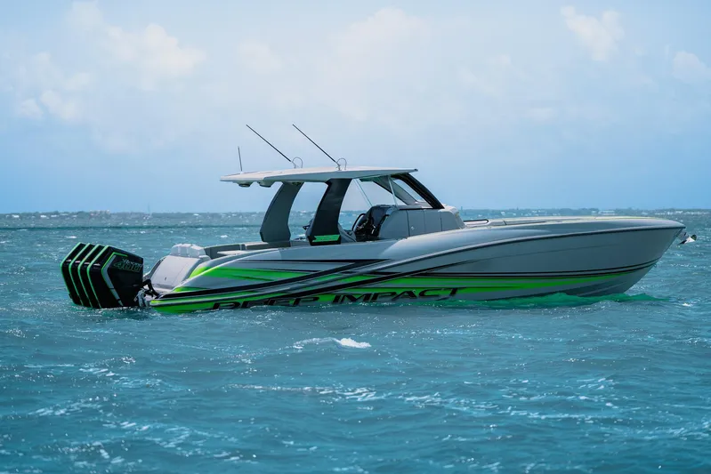  Yacht Photos Pics 2026 Deep Impact 399 Sport boat on open water, featuring sleek design and vibrant accents.