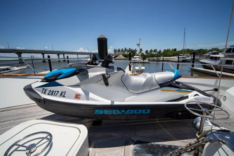 Flying Dutchman Yacht Photos Pics Jet ski on Lloyds Ships Tri-Deck yacht, 1984 model, docked at marina with bridge view.
