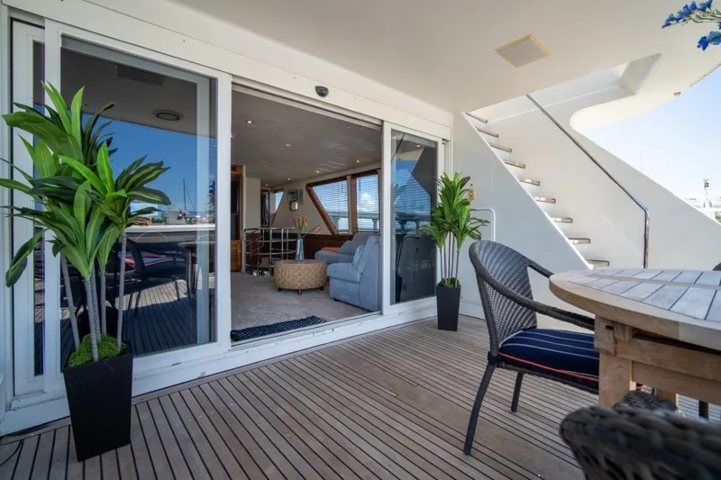 Flying Dutchman Yacht Photos Pics Luxurious 1984 Lloyds Ships Tri-Deck yacht interior with elegant seating and outdoor dining area.