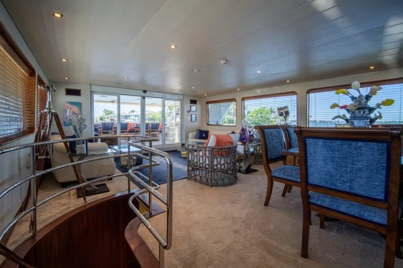 Flying Dutchman Yacht Photos Pics Luxurious interior of 1984 Lloyds Ships Tri-Deck yacht with elegant furnishings and panoramic windows.