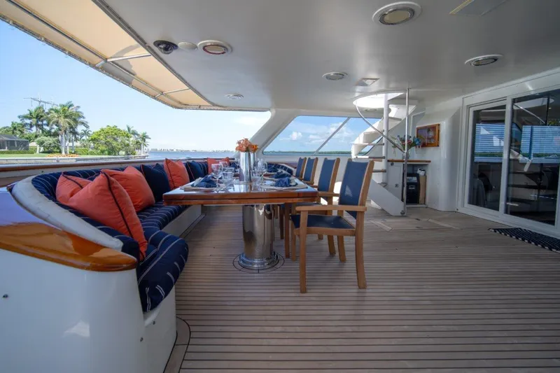 Flying Dutchman Yacht Photos Pics Luxurious 1984 Lloyds Ships Tri-Deck yacht deck with elegant dining area and scenic views.
