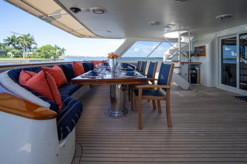 Flying Dutchman Yacht Photos Pics Luxurious 1984 Lloyds Ships Tri-Deck yacht deck with elegant dining area and ocean view.