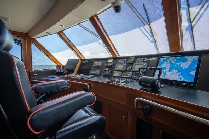 Flying Dutchman Yacht Photos Pics Luxurious 1984 Lloyds Ships Tri-Deck yacht bridge with navigation equipment and captain's chair.