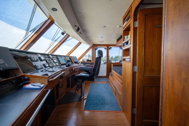 Flying Dutchman Yacht Photos Pics Luxurious 1984 Lloyds Ships Tri-Deck yacht interior with navigation controls and wooden finishes.