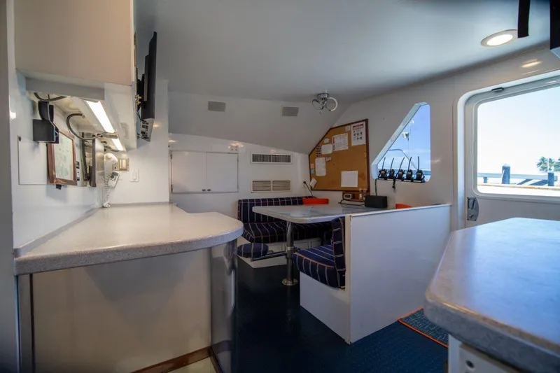 Flying Dutchman Yacht Photos Pics Interior of 1984 Lloyds Ships Tri-Deck yacht with seating area and communication equipment.