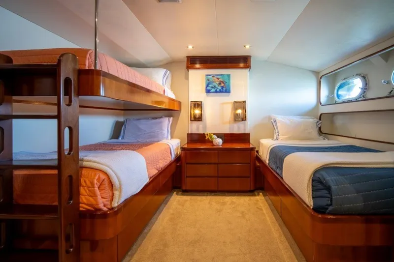 Flying Dutchman Yacht Photos Pics Luxurious 1984 Lloyds Ships Tri-Deck yacht cabin with bunk beds and elegant wood finishes.
