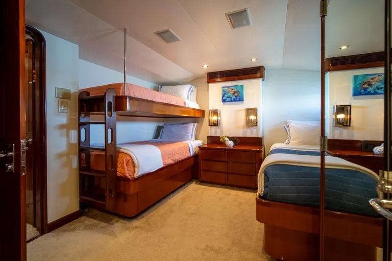 Flying Dutchman Yacht Photos Pics Luxurious 1984 Lloyds Ships Tri-Deck yacht cabin with bunk beds and elegant decor.