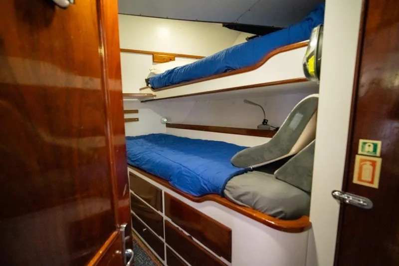 Flying Dutchman Yacht Photos Pics Cozy bunk bed cabin in 1984 Lloyds Ships Tri-Deck yacht with wooden accents.