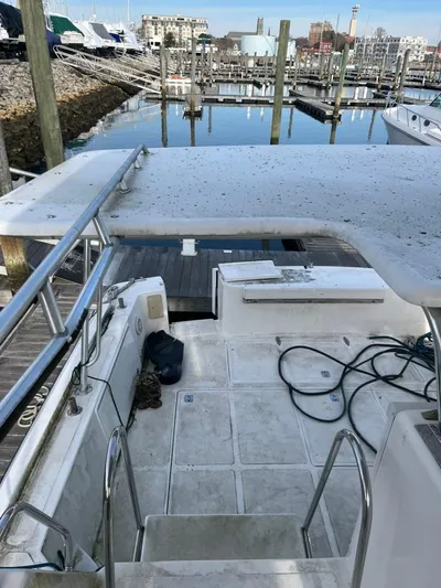 Warrior Yacht Photos Pics 2005 Albin 45 Command Bridge yacht docked at marina, view of deck and seating area.