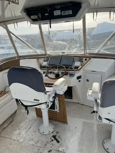 Warrior Yacht Photos Pics 2005 Albin 45 Command Bridge helm with dual seats and navigation equipment.