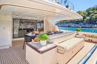 Luxurious 2007 Custom Line 97 yacht deck with elegant seating and ocean view.