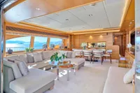 Luxurious interior of 2007 Custom Line 97 yacht with elegant seating and dining area.