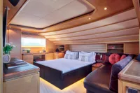 Luxurious bedroom interior on 2007 Custom Line 97 yacht, featuring elegant wood finishes and modern design.