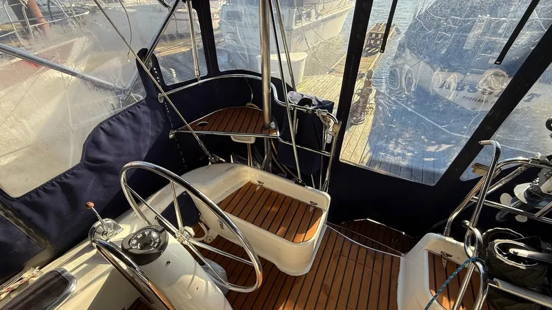  Yacht Photos Pics 2004 Catalina 470 yacht cockpit with dual steering wheels and wooden flooring.