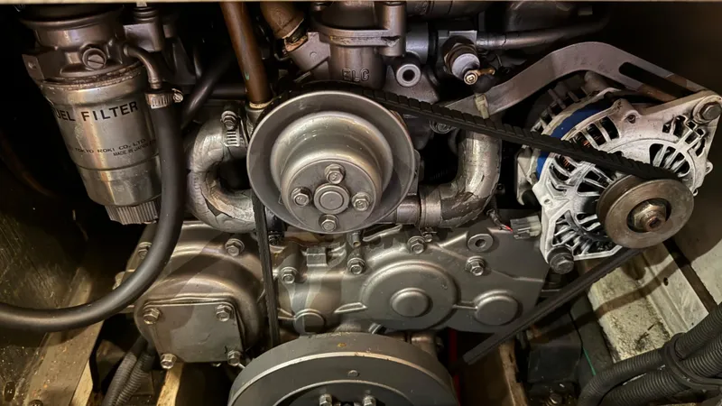  Yacht Photos Pics Engine components of a 2004 Catalina 470, featuring a diesel filter and alternator belt.