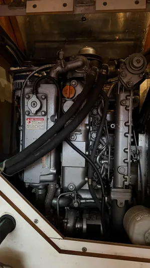  Yacht Photos Pics Engine compartment of a 2004 Catalina 470 sailboat, showcasing detailed mechanical components.