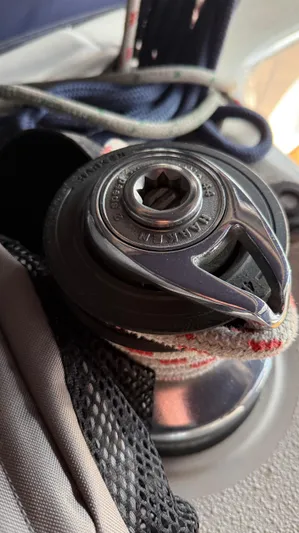  Yacht Photos Pics Close-up of a winch on a 2004 Catalina 470 sailboat with ropes.