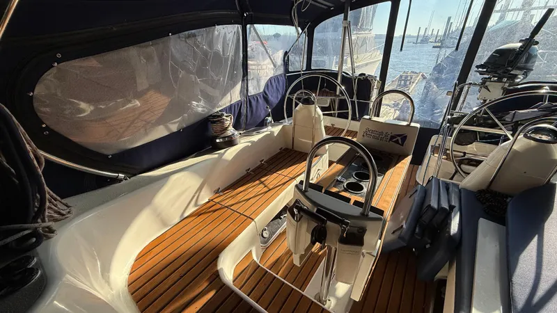  Yacht Photos Pics 2004 Catalina 470 yacht cockpit with wooden flooring and dual steering wheels.