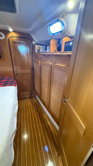  Yacht Photos Pics Interior of 2004 Catalina 470 yacht with wooden cabinetry and flooring.