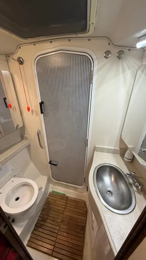  Yacht Photos Pics 2004 Catalina 470 yacht bathroom with shower, sink, and toilet.