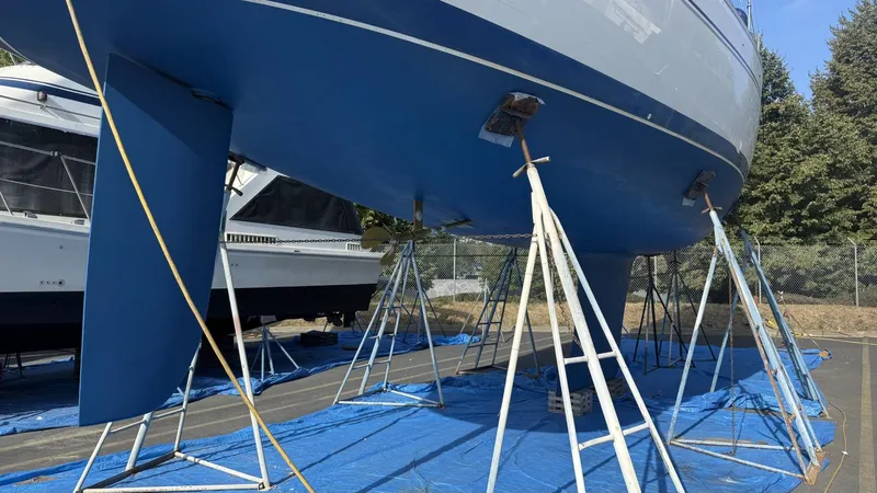  Yacht Photos Pics 2004 Catalina 470 sailboat on stands, blue hull, outdoor storage.