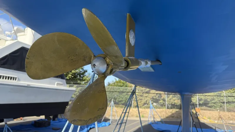  Yacht Photos Pics Close-up of a 2004 Catalina 470 sailboat propeller, displayed on a stand.